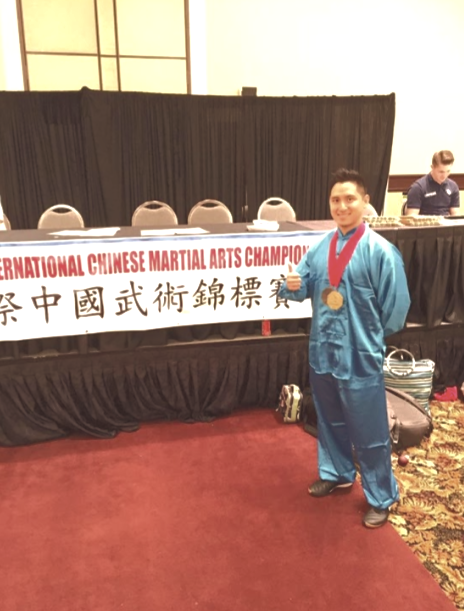 Peter Wu wearing his gold medal at the International Chinese Martial Arts Championship